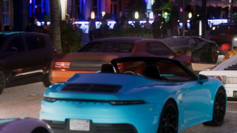 Une Pfister Comet S2 Cabrio rouge sport, décapotée, roulant sur une route ensoleillée de Vice City.