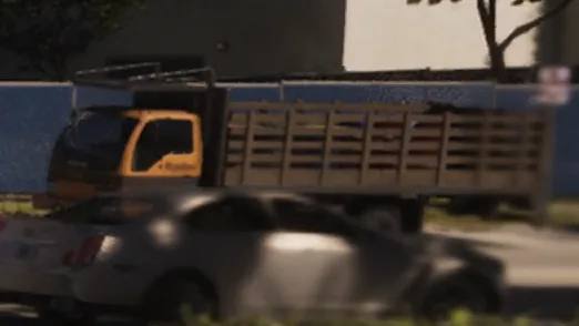 Un camion inspiré de l'Isuzu Elf de couleur blanche, garé devant un chantier de construction dans GTA 6.