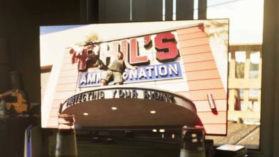 Phil tirant à la mitrailleuse légère devant son armurerie dans une publicité du trailer 2 de GTA 6