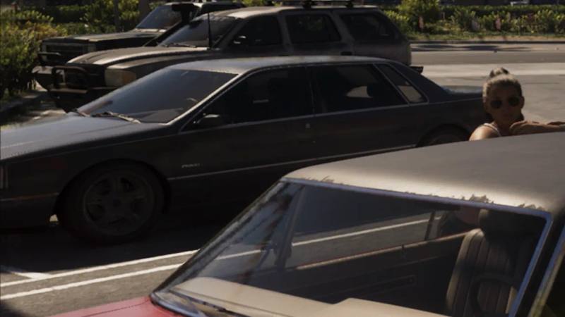 Une Albany Primo bleue aperçue dans le premier trailer de GTA 6, roulant sur la voie opposée.