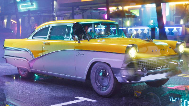 Un Vapid Stanier (1955) jaune et blanc garé devant un bâtiment, avec une ambiance rétro.