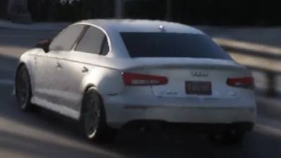 Une Obey Tailgater S garée dans un environnement urbain, attendant la confirmation de sa présence dans GTA 6.